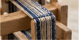 Inkle band still tensioned on loom